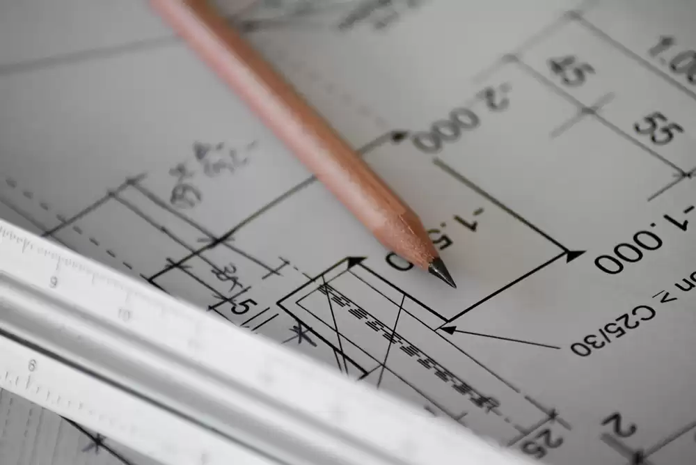 a paper and pencil with markings and construction measurements for a project